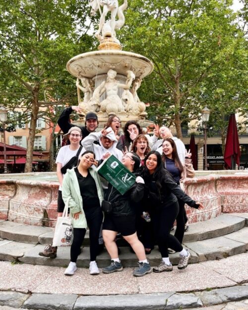 Flsa Students Pose In Front Of A Water Fountain