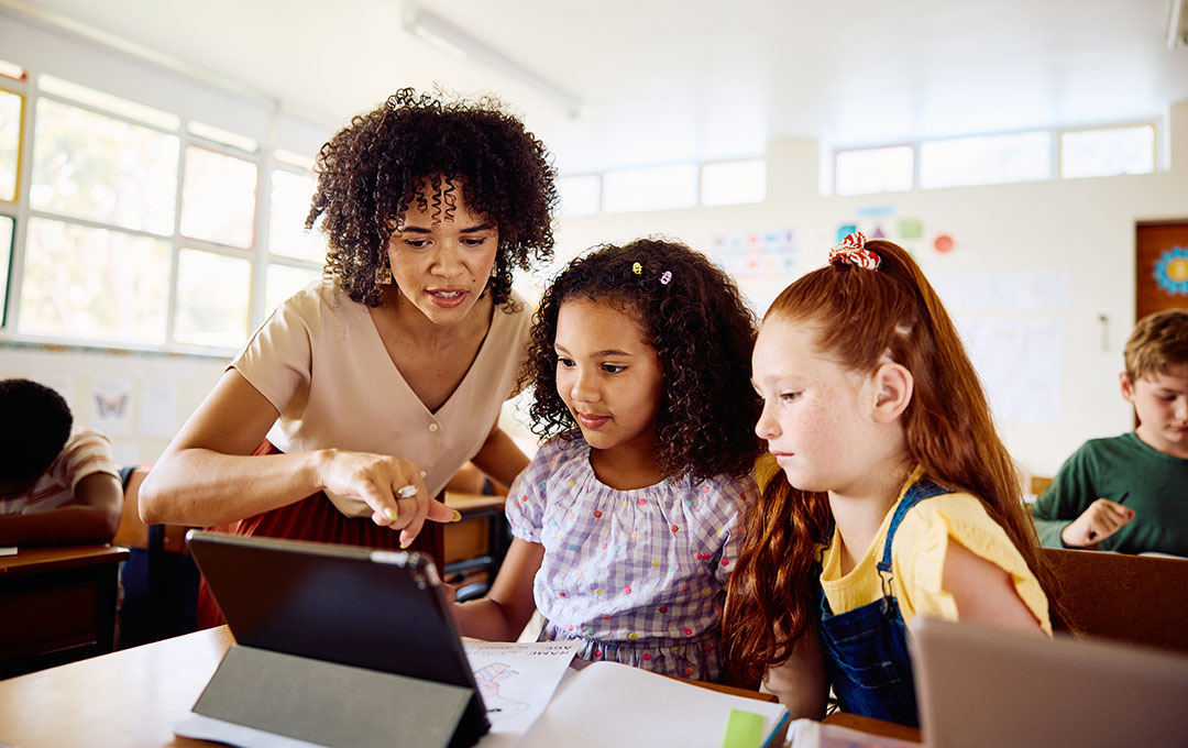 teacher talking with students
