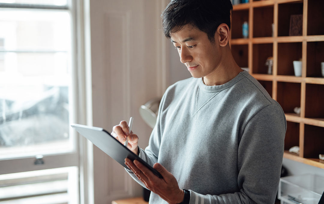 man working on his ipad