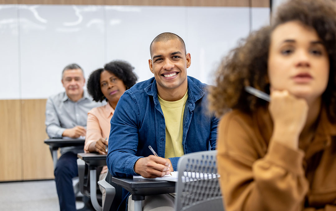students in classroom, listening to a lecture