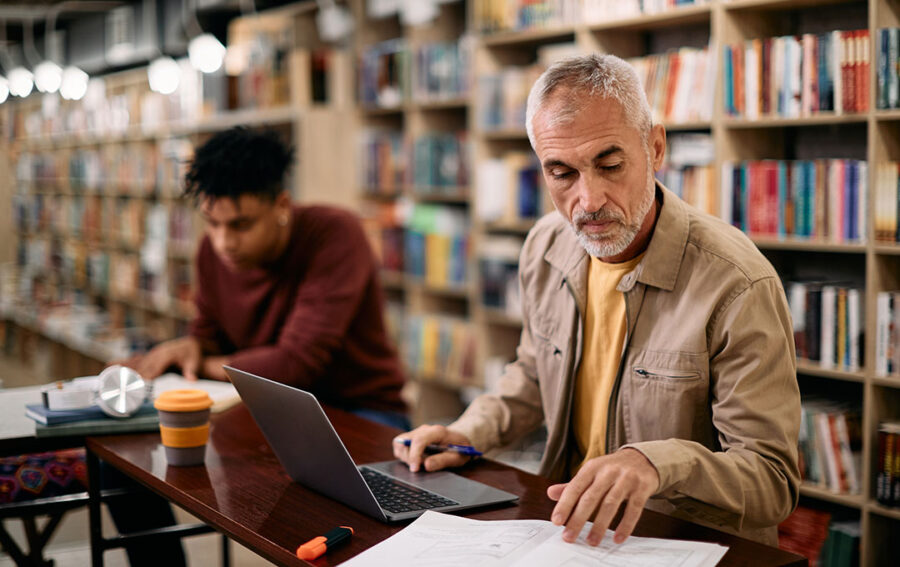 Men studying in the library