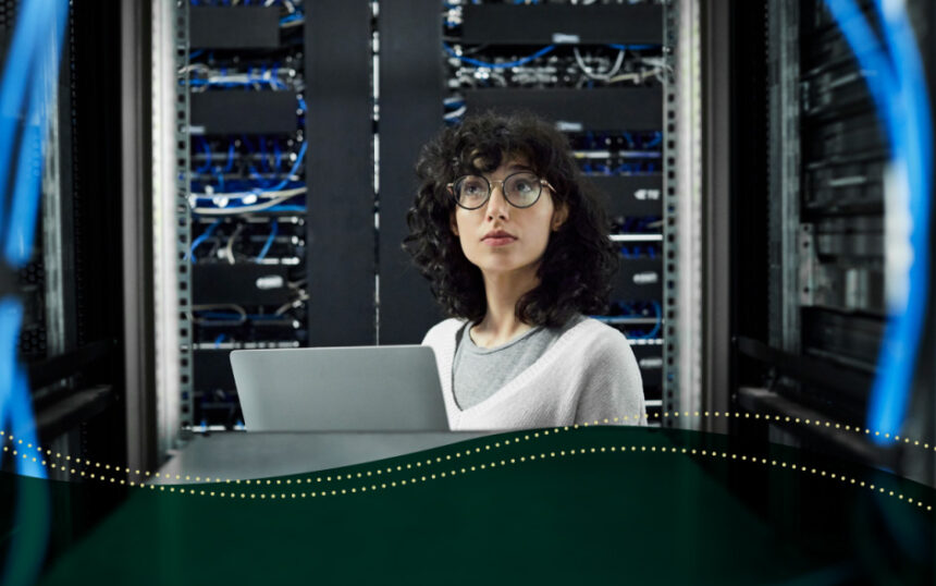 Female technician looking at cables