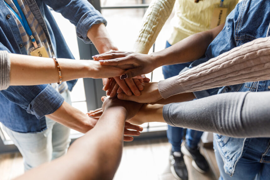 Close-up shot of individuals forming a united front