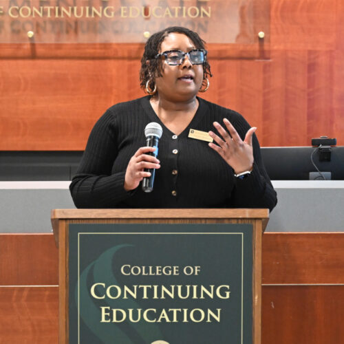 Dr. Pamela Wimbush Speaking At A Podium
