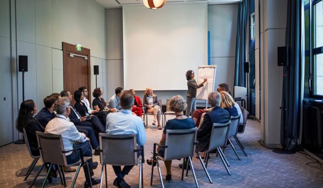Businesswoman explaining strategy over a flip chart